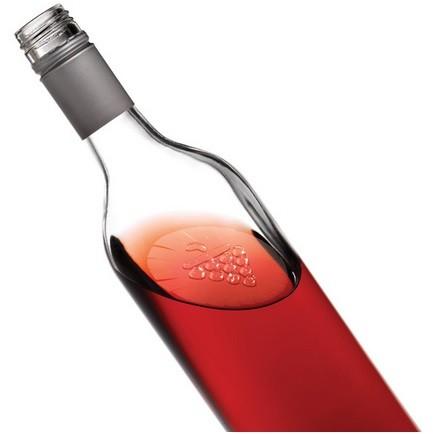 Wine Shield. Disco flexible que flota en la botella una vez abierta